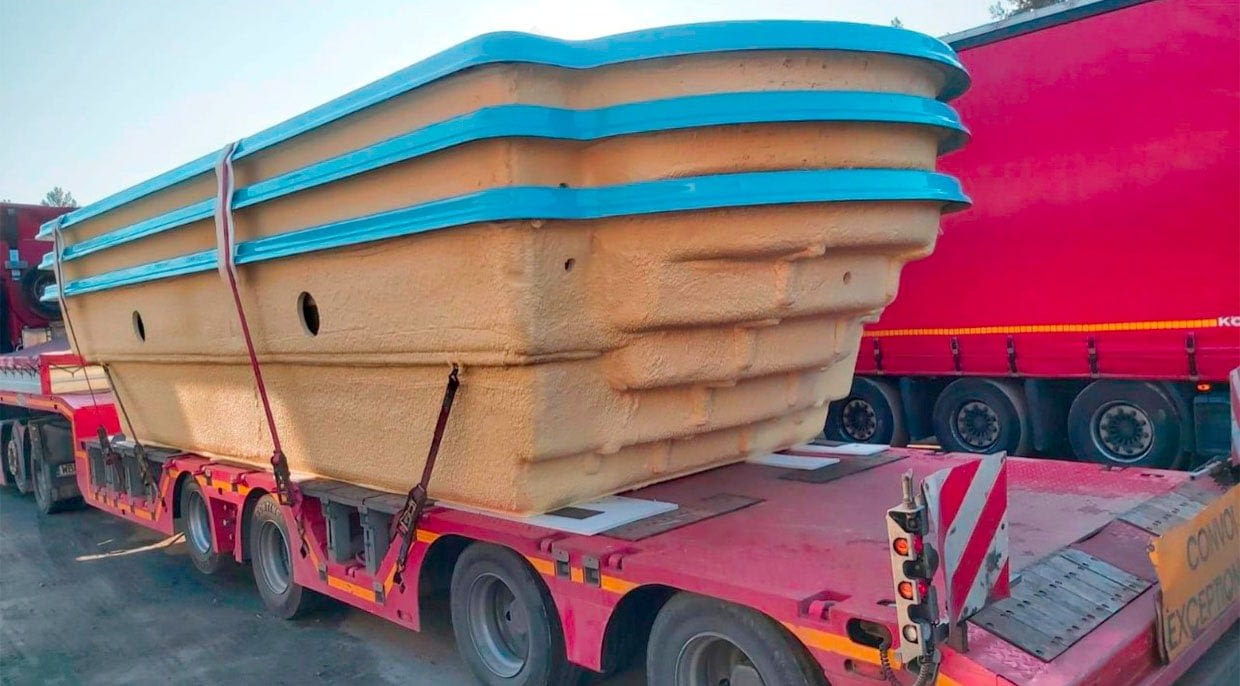 b2b stacked fibreglass swimming pools on oversized load truck